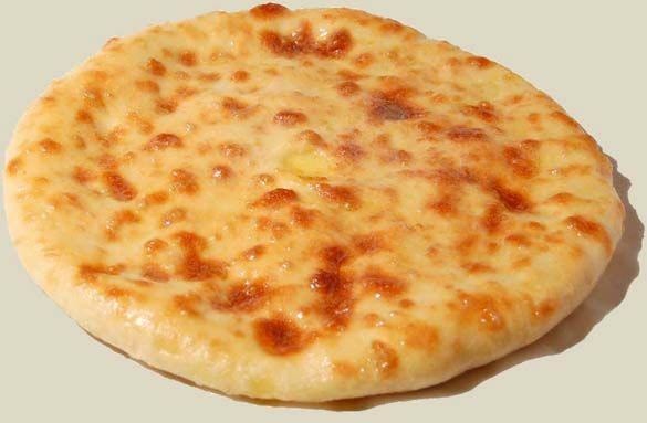 Осетинский пирог с начинкой из свекольных листьев и осетинского сыра.